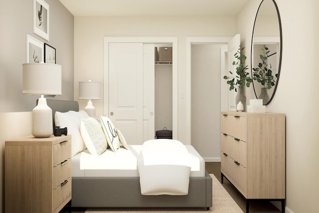 bedroom with baseboards and a closet