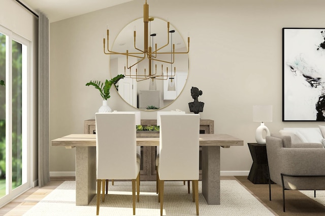 dining space featuring a chandelier and baseboards