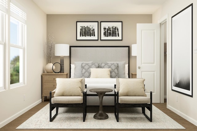 carpeted bedroom featuring baseboards