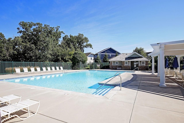 view of swimming pool with a pergola and a patio area