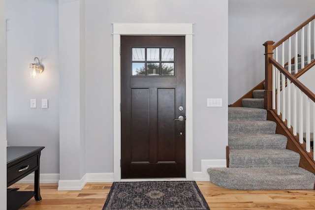 entrance foyer featuring wood-type flooring