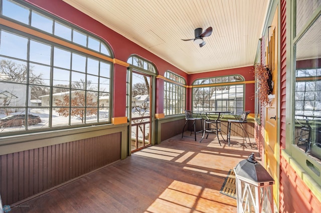 sunroom with ceiling fan and a wealth of natural light