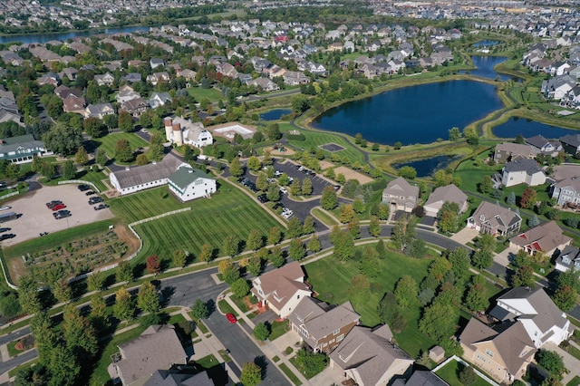 bird's eye view featuring a residential view and a water view