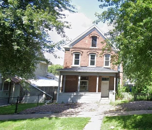 victorian-style house featuring covered porch