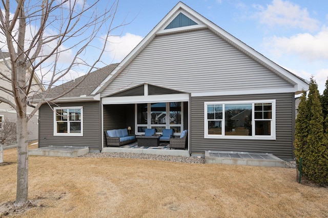 back of house with an outdoor hangout area and a patio area