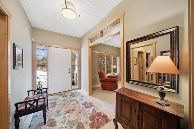 entryway with a textured ceiling