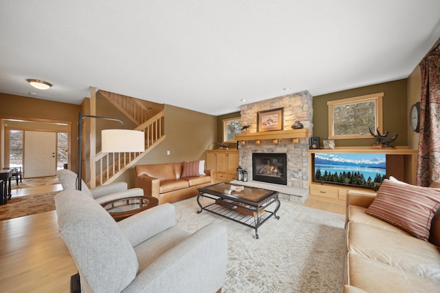 living room featuring a fireplace and light hardwood / wood-style floors