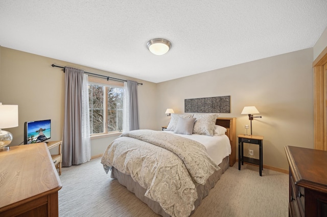 carpeted bedroom featuring a textured ceiling