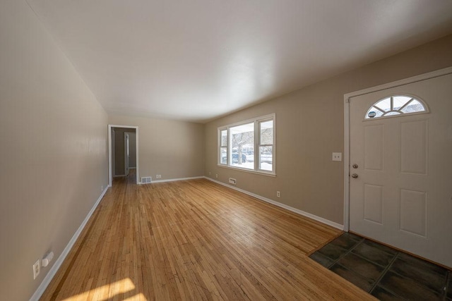 foyer entrance with wood-type flooring