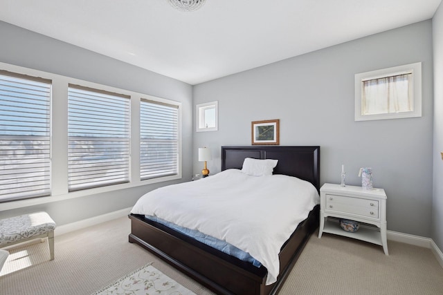 carpeted bedroom with baseboards