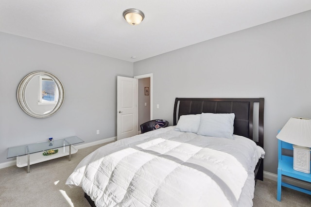 bedroom with carpet floors and baseboards