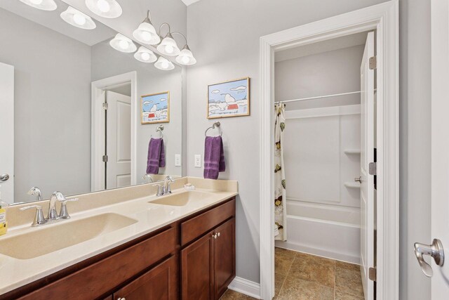 full bathroom with shower / tub combo with curtain, a sink, and double vanity