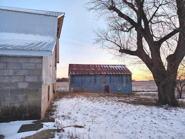 yard covered in snow with an outdoor structure