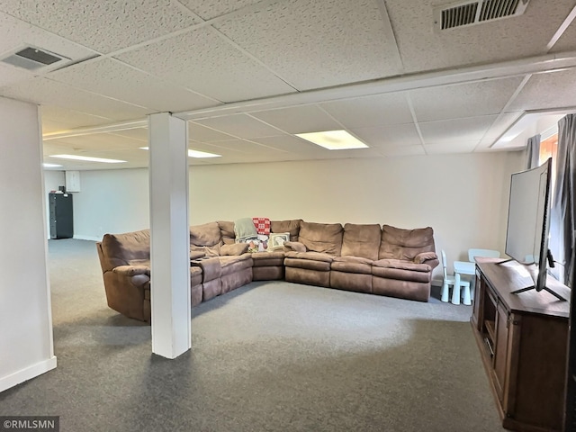 living room with visible vents, baseboards, and carpet