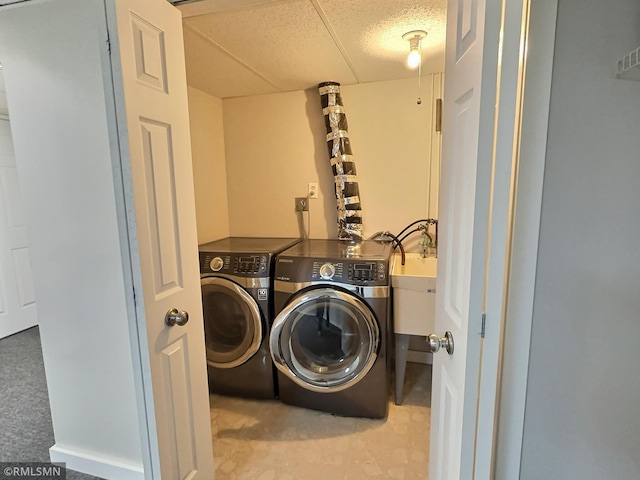 clothes washing area with laundry area and separate washer and dryer