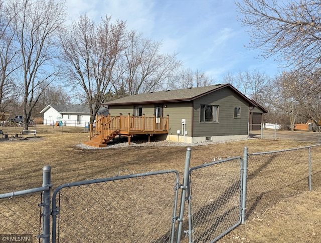 view of front facade featuring a fenced front yard, a deck, and a gate