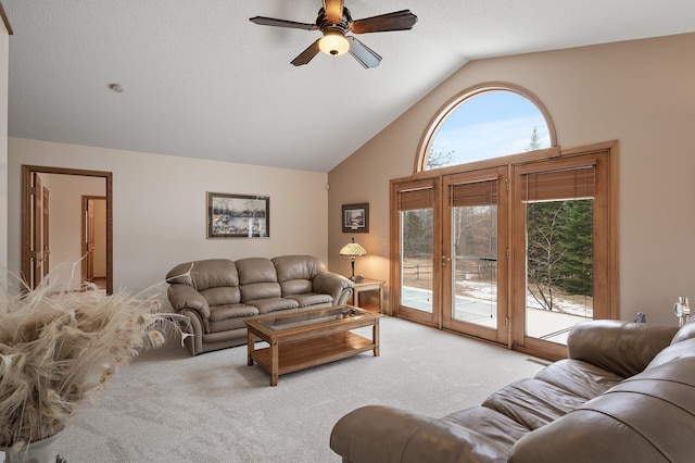 living room featuring a ceiling fan, carpet, french doors, and high vaulted ceiling