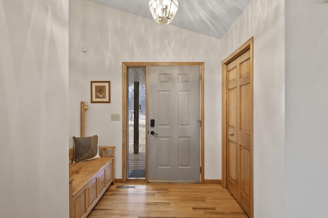 entrance foyer with light wood-type flooring and baseboards