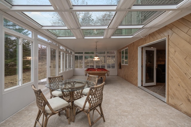 sunroom with a skylight and coffered ceiling