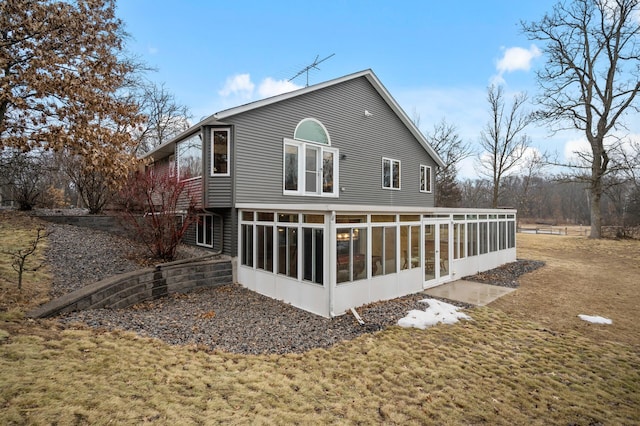 back of house with a sunroom