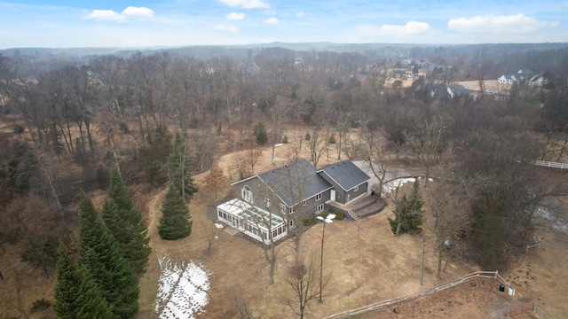 birds eye view of property with a wooded view