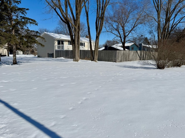 view of yard covered in snow