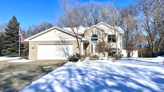 view of front facade with driveway and an attached garage