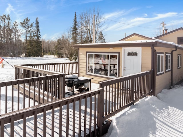 view of snow covered deck