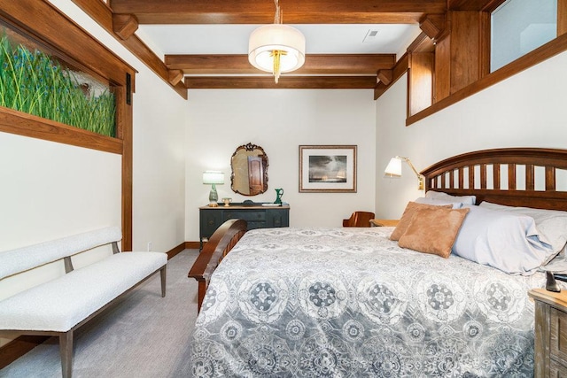 carpeted bedroom featuring baseboards and beamed ceiling