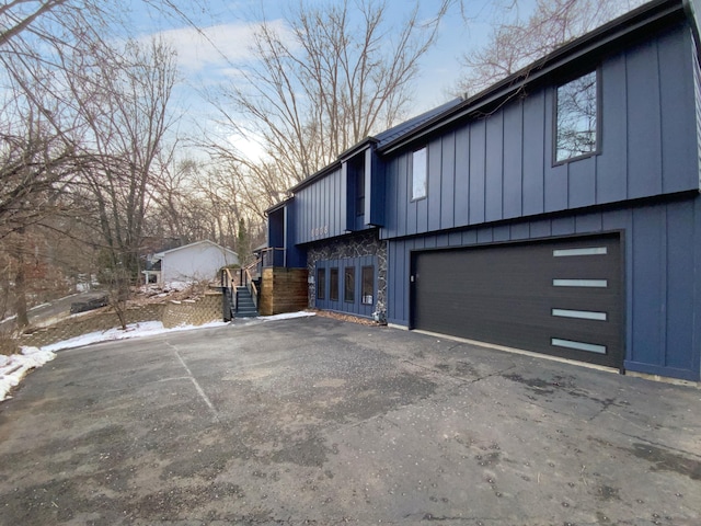 property exterior at dusk with a garage