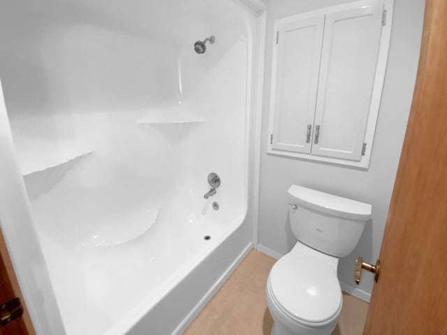 bathroom with shower / bathing tub combination and toilet