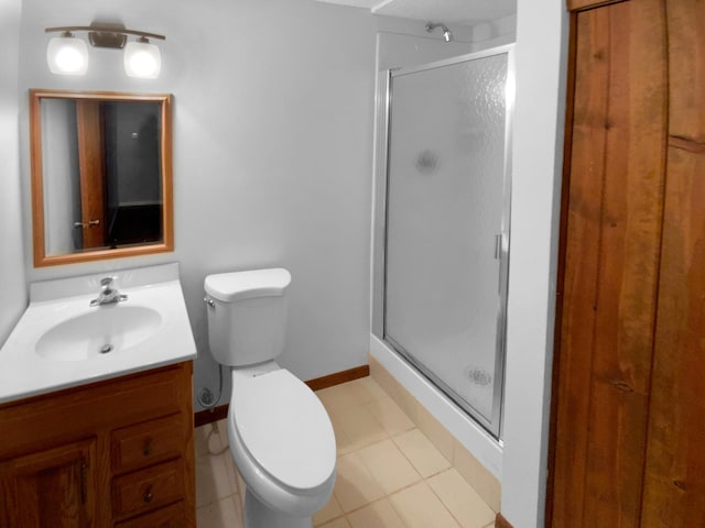 bathroom with toilet, tile patterned flooring, an enclosed shower, and vanity