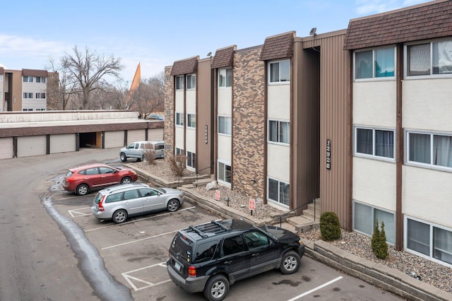 view of property with uncovered parking