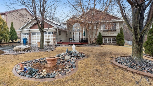 view of front of property featuring a garage and a front yard