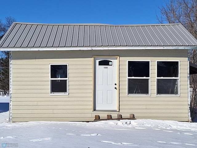 exterior space featuring metal roof