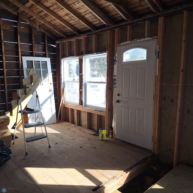 miscellaneous room with lofted ceiling