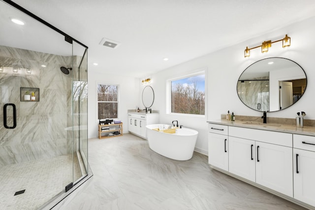 bathroom featuring marble finish floor, a marble finish shower, visible vents, and vanity