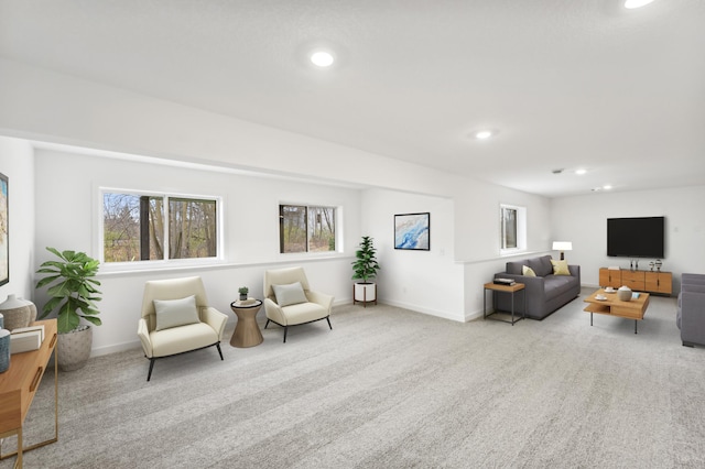 sitting room featuring carpet floors, recessed lighting, and a healthy amount of sunlight