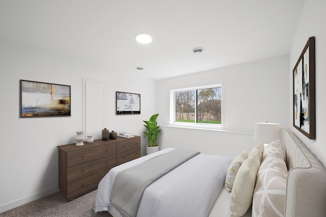 carpeted bedroom with baseboards