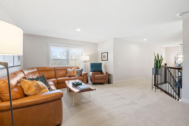 carpeted living room featuring baseboards and recessed lighting