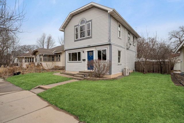 view of front of home with fence and a front yard