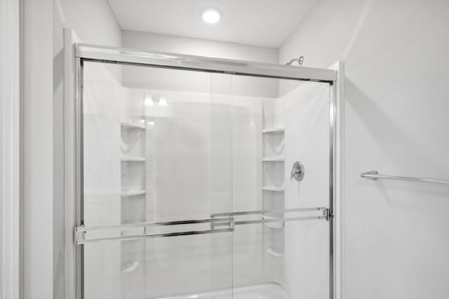 bathroom featuring a shower stall