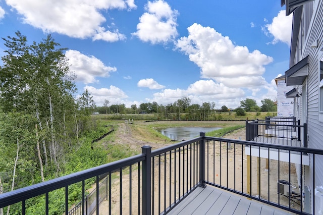 wooden deck featuring a water view