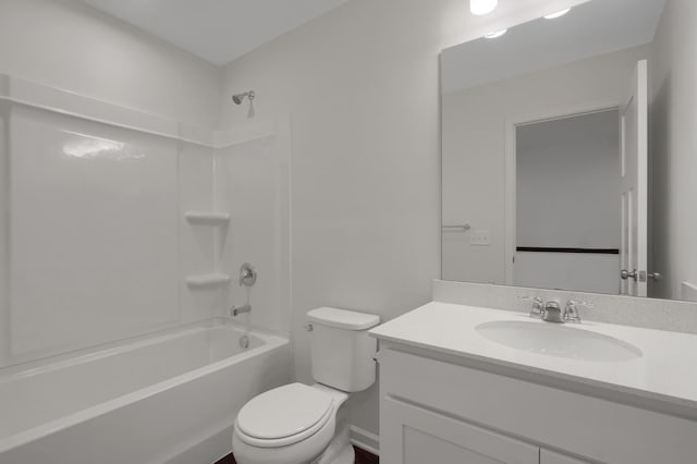 bathroom featuring toilet, washtub / shower combination, and vanity