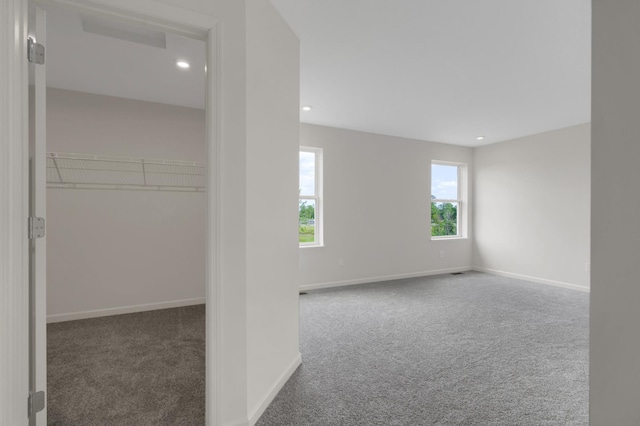 unfurnished room with carpet floors, baseboards, and recessed lighting