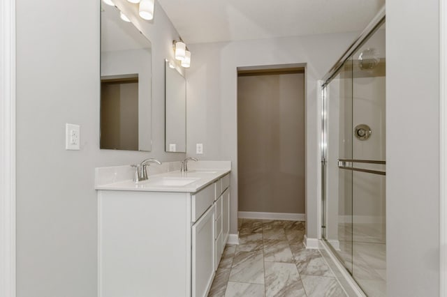 bathroom with vanity and an enclosed shower