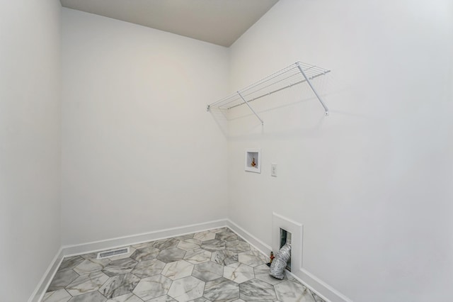 laundry room featuring laundry area, hookup for a washing machine, visible vents, and baseboards