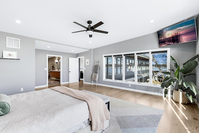 bedroom featuring wood finished floors, visible vents, and recessed lighting