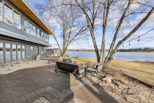 view of patio featuring a water view