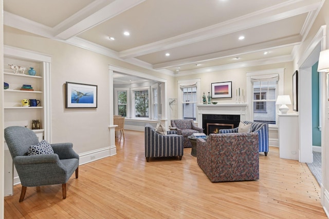 4943 Dupont Ave S, Minneapolis, MN 55419 - living room featuring light wood-style floors, beam ceiling, crown molding, a lit fireplace, and recessed lighting